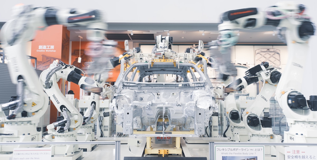 Robotic arms assembling products on a factory production line