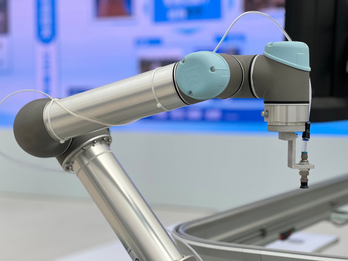Close-up of a modern industrial robotic arm gripper